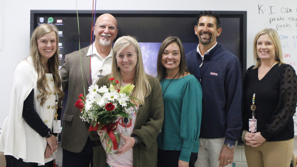 Bulloch County Schools administrators with the school district&#8217;s new teacher of the year (L-R): Alli Baxter, Chief Human Resources Officer; Charles Wilson,