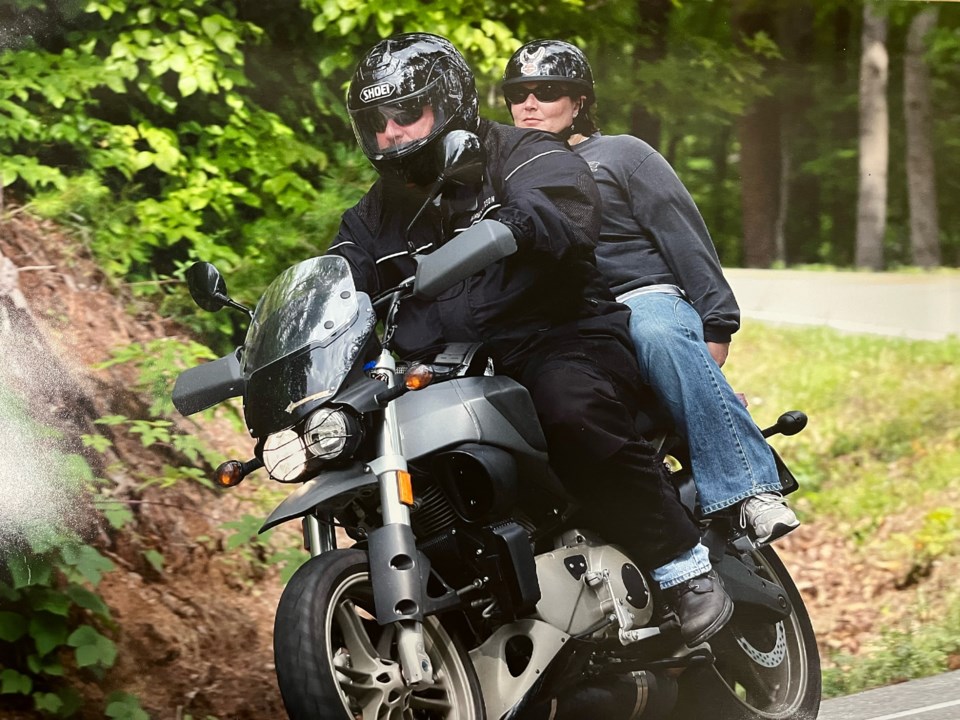 ty-cobler-w-becky-riding-motorcycle