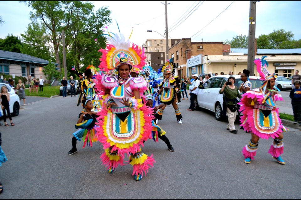 Dancers from the Junkanoo All Stars line up for a rhythmic march down Essex Street. Troy Bridgeman for GuelphToday.com