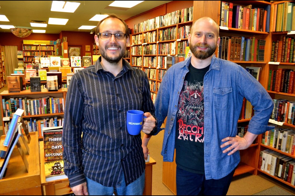 Janus Books owner Kieran Dunn with staff member Andrew Meek.  Troy Bridgeman for GuelphToday.com