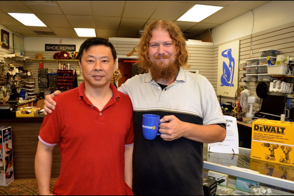 David Xuefeng Ren from David Hi Tech Shoe Repair & Leather and Shoeless Joseph St. Denis from Tools and Tech at the shop they share on Municipal Street. Troy Bridgeman for GuelphToday.com