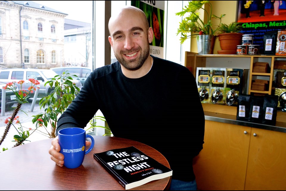 Author Marco Muzzi at Planet Bean downtown Guelph where he wrote most of his murder-mystery novel, 'The Restless Night'. Troy Bridgeman for GuelphToday