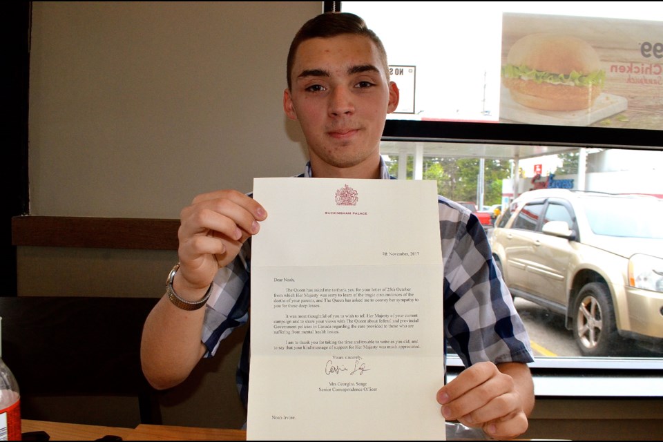 Noah Irvine with a letter he received from a representative of Queen Elizabeth ll.  Troy Bridgeman for GuelphToday.com