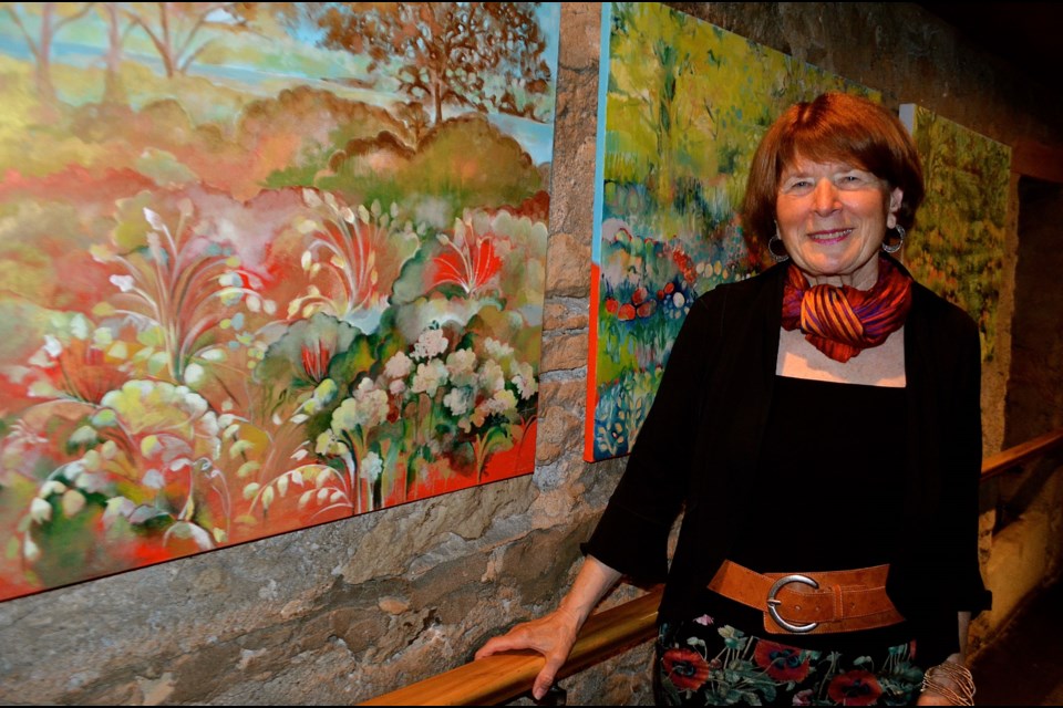 Artist and activist Sharyn Seibert with paintings inspired by the natural beauty of Ontario Reformatory lands on York Road.  Troy Bridgeman for GuelphToday.com