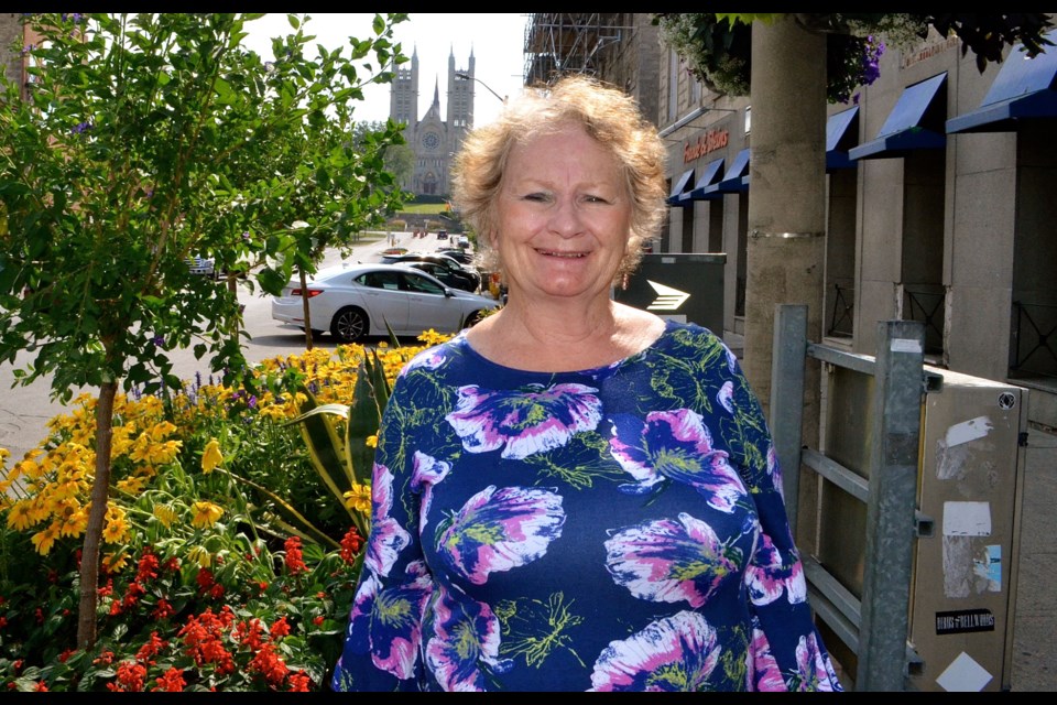 Susan Ratcliffe on Macdonell Street with the city’s iconic vista behind.  Troy Bridgeman for GuelphToday.com