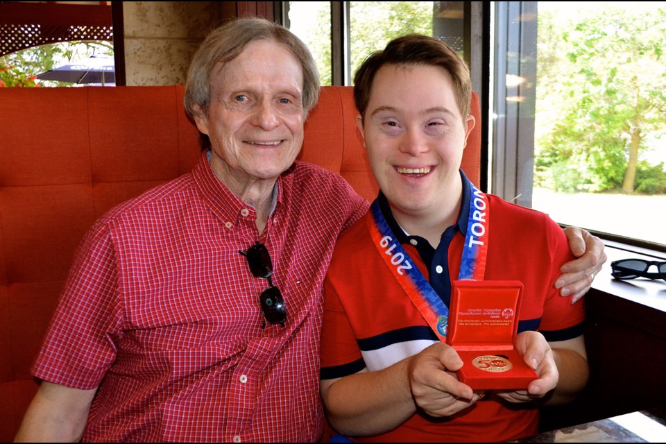 Special Olympian and sports radio host Taylor Redmond with his father Steve Redmond. Troy Bridgeman for GuelphToday.com