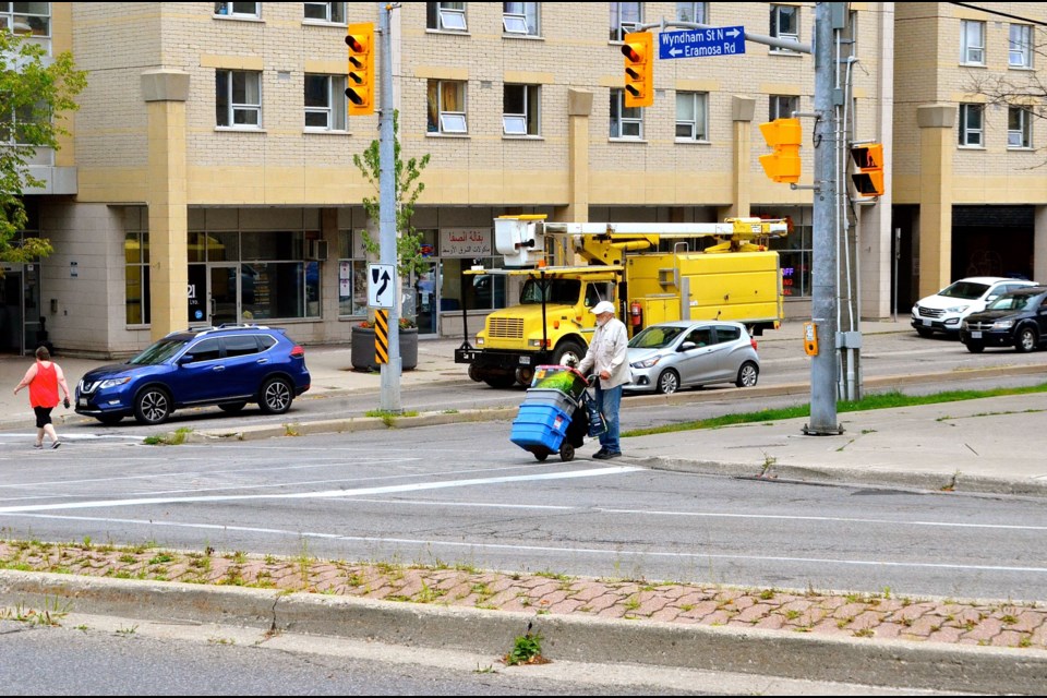 Community activist Ed Pickersgill arrives with supplies for The Bench.  Troy Bridgeman for GuelphToday.com