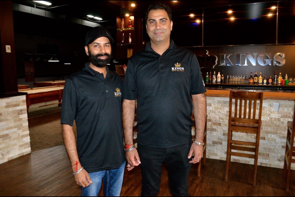 Gurdeep Singh and brother Davinder Singh inside the new Kings Sports Bar & Grill on Woodlawn Road. Troy Bridgeman for GuelphToday.com