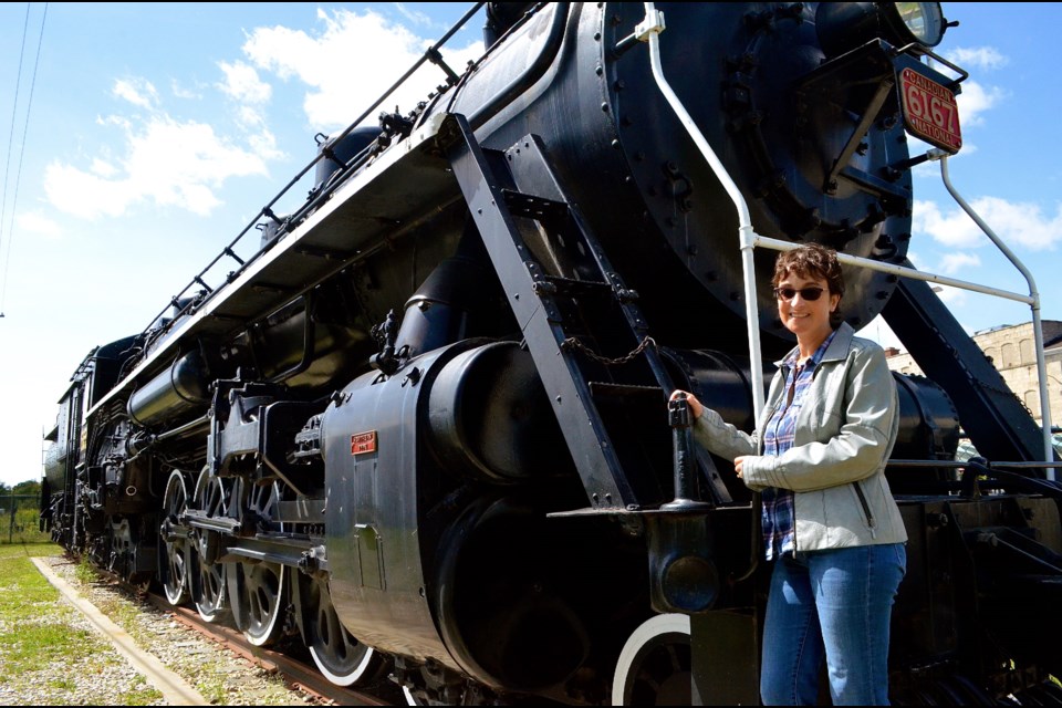 Danna Evans general manager of Culture, Tourism and Community for the City of Guelph with Locomotive 6167.  Troy Bridgeman for GuelphToday.com