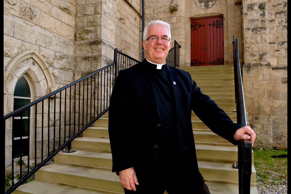 Pastor Ian Duffy on the steps of the north entrance of Basilica of Our Lady Immaculate. Troy Bridgeman for GuelphToday.com