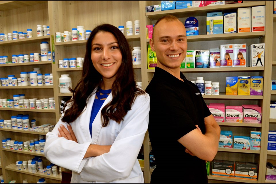 Founder of Pharmasea Justin Macorin with pharmacist Sarah Johnson at Willow Pharmacy. Troy Bridgeman for GuelphToday.com