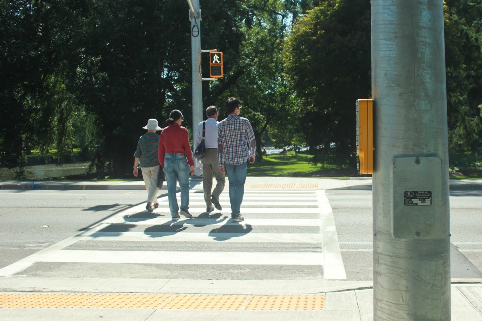 Crosswalk users walk towards Royal City Park. Anam Khan/GuelphToday