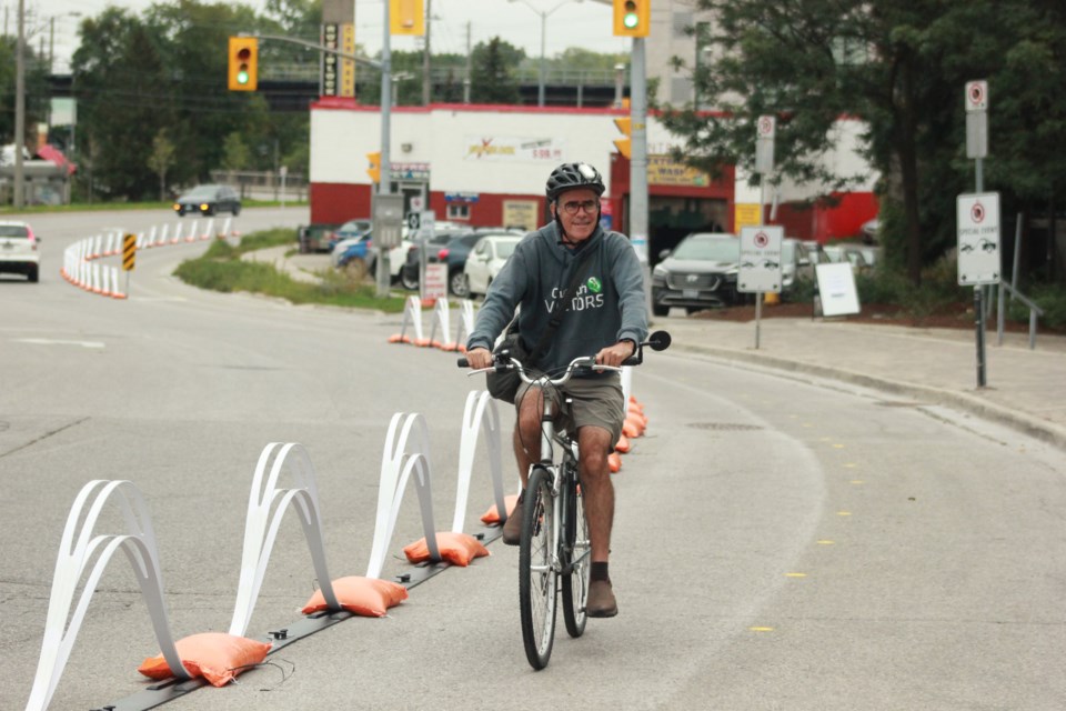 A man cycles on the temporary bike lane. Anam Khan/GuelphToday