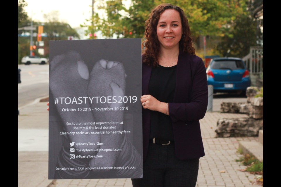 Allison Mitchell holds a Toasty Toes poster to kick off the 2019 campaign. Anam Khan/GuelphToday