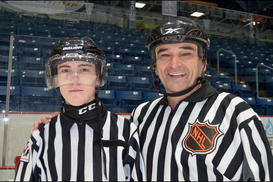 Referees Andy Van Hellemond and his grandson Aidan Vivian during the Rotary Hockey Challenge, Saturday at the Sleeman Centre.  Troy Bridgeman/GuelphToday  