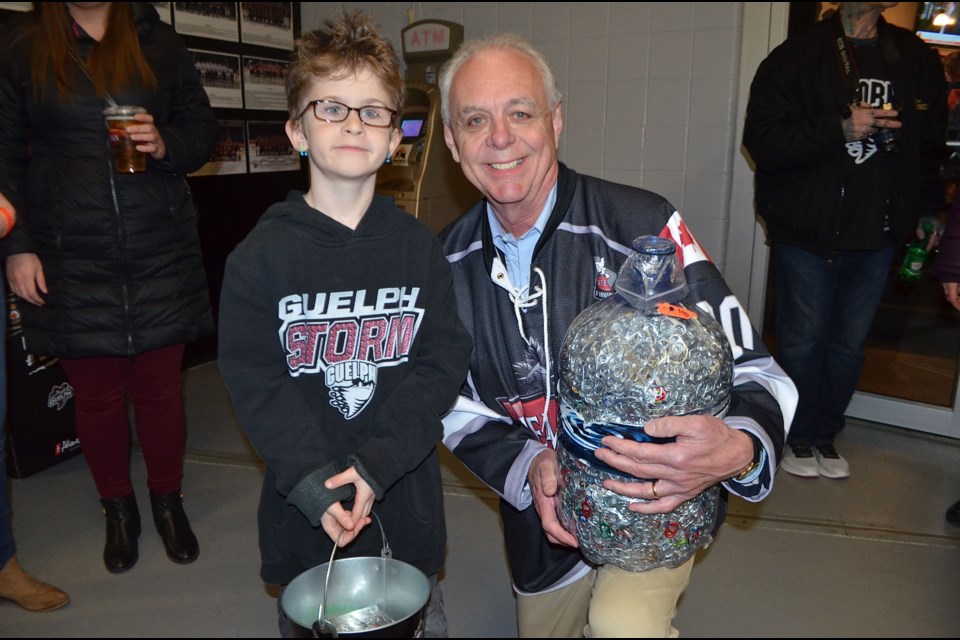  John Sleeman and Wade Grigsby with his collection of tabs. Troy Bridgeman/GuelphToday