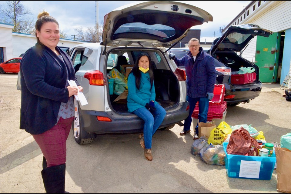 Guelph Food Bank administrator Pauline Cripps with Stronger Together food drive organizers Betsy Scott and Ed Clayson. Troy Bridgeman/GuelphToday