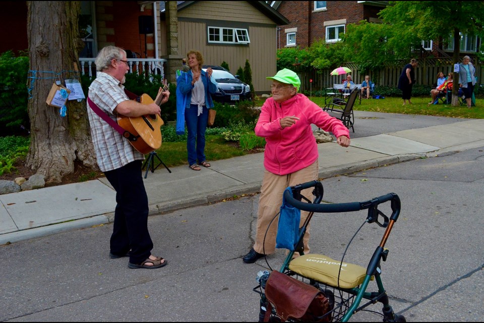 90-year-old Alice McNeish pushes her walker aside to dance during a performance by MacTalla Road featuring Bob MacLean and Carol Pines.  Troy Bridgeman/GuelphToday 