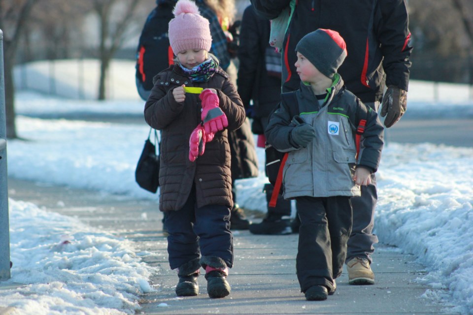A young student gushes over her 'walk to school ticket' in the morning. Anam Khan/GuelphToday