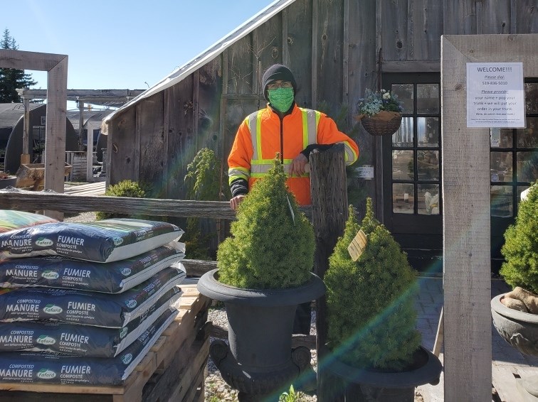 Manager of Brock Road Nursery Garden Centre Andre Marthaler stands in front of his garden centre wearing a mask on May 4. Supplied photo. 