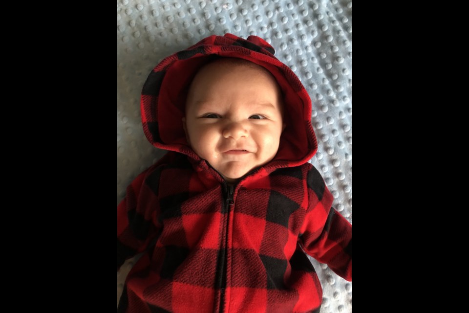 Baby Max Cameron is all smiles for the camera at home. Supplied photo