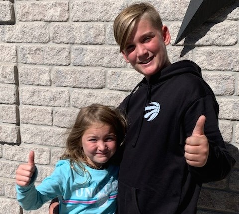 Jacob and Leah give a thumbs up after their run at Waterloo's RIM Park to raise $10,000 in memory of their grandma. Supplied photo