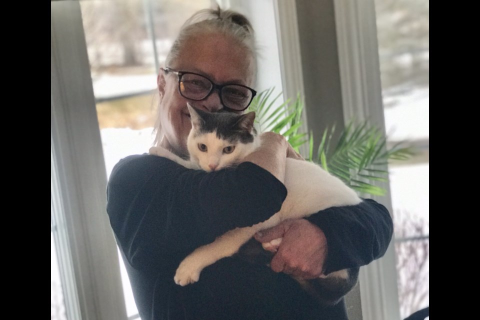 Daina Makinson from Puslinch holds Steve the short-haired feral cat. Steve made it to the quarter-final round of America's Favourite Pet. Supplied photo