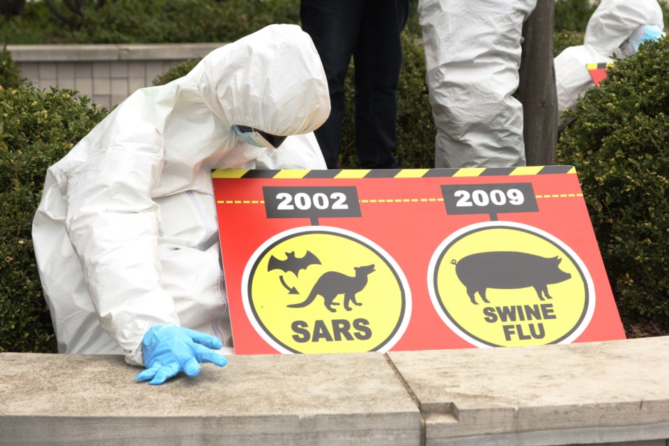 A dummy holds a sign showcasing origins of viruses in front of City Hall on Saturday Anam Khan/GuelphToday