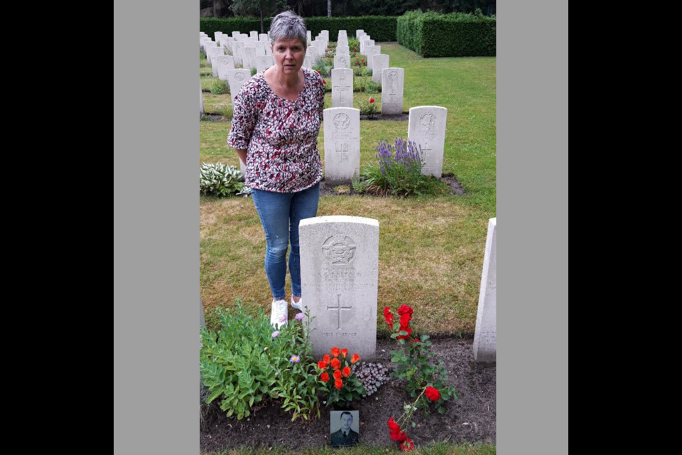 Rean Snijders-van Meijel from the Netherlands stands by the grave of  Andrew George Balfour, a Canadian soldier from Guelph who died during the Dutch Liberation. Balfour's grave was passed down to her by her grandmother. His grave is in the Venray War Cemetary. Supplied photo