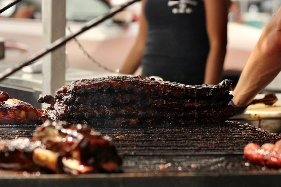 Stacks of ribs at Billy Bones BBQ. Rotary Club of Guelph's 2021 Drive Thru Ribfest saw cars line up and order from three restaurants that cooked on site: Billy Bones BBQ, Silver Bullet BBQ annd Boss Hogs BBQ. The event was was held in the parking lot of Centennial high school .