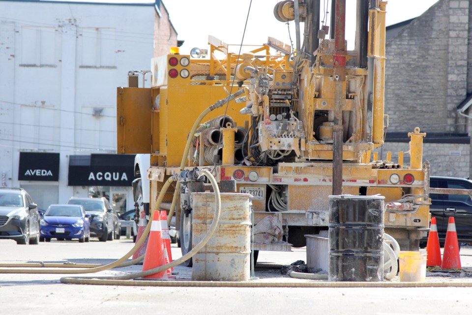 Bore drilling work began in Baker Street parking lot on Friday. Some cars were still parked in the lot. 