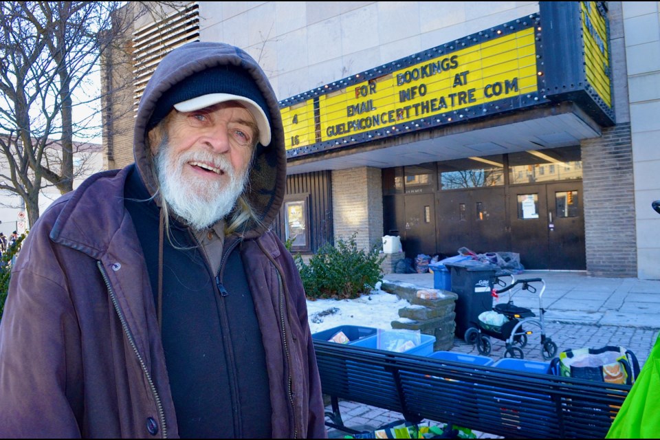 Poet and anti-poverty activist Ed Pickersgill braves the cold and stands next to The Bench where he has been helping feed and clothe Guelph’s homeless every afternoon since 2017