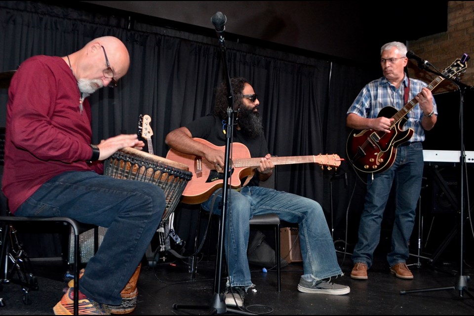 Musicians Richard Smit, Vazzy and Mark Jitomitsky perform during an open mic at Royal City Studios on Woodlawn Road.