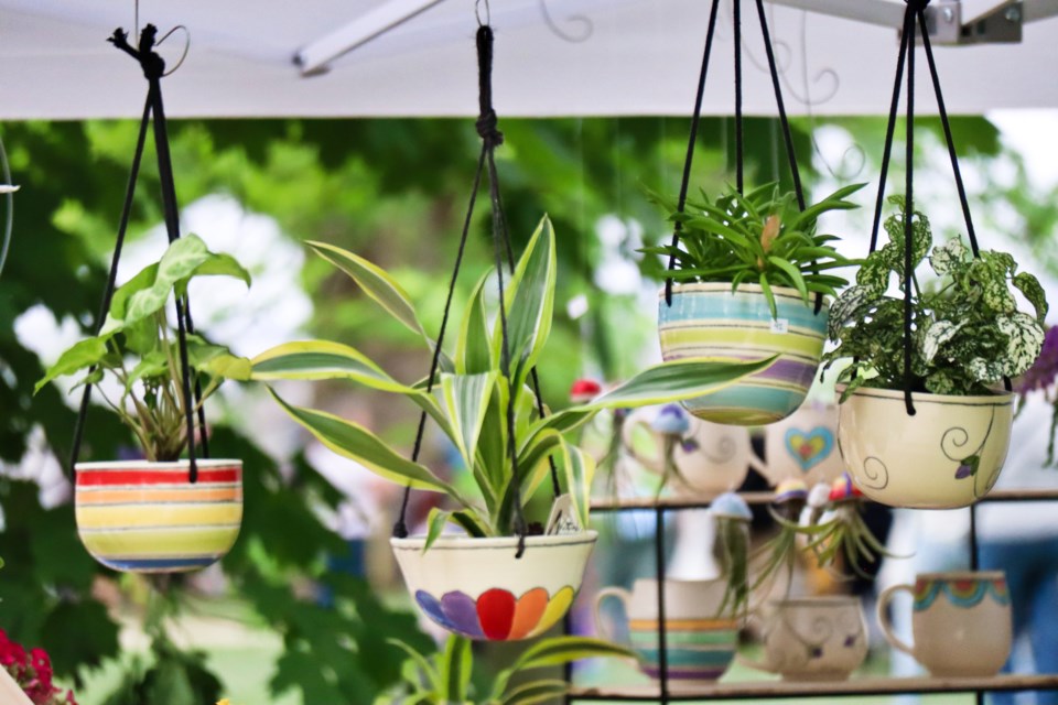 A series of colourful clay hanging pots at the 2022 Guelph Potters Market. 