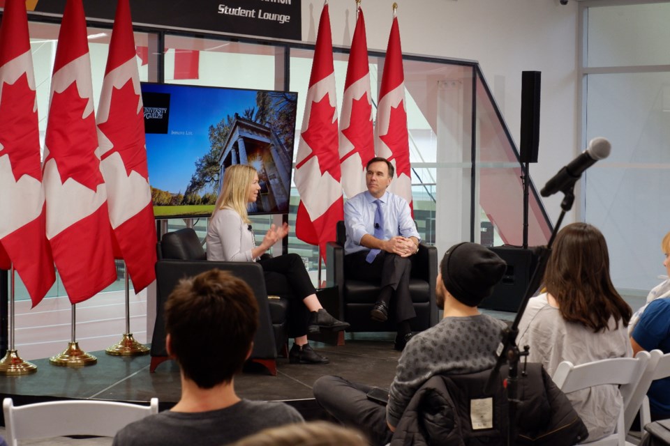 Student Danyelle Liddle has a discussion with Finance Minister Bill Morneau. Anam Khan/GuelphToday