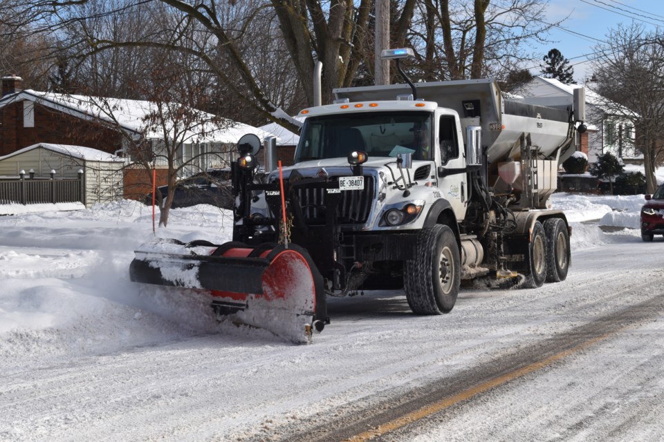 A snowplow clears the streets in Guelph after a blizzard.