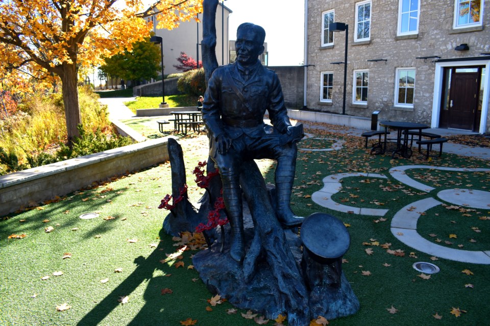 The John McCrae statue outside the Guelph Civic Museum.
