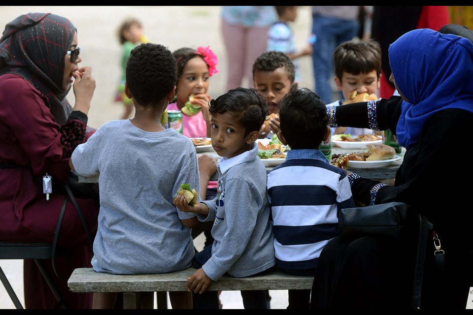 Enjoying a meal with family at the Muslim Society of Guelph's annual community barbecue Saturday, July 29, 2017. Tony Saxon/GuelphToday
