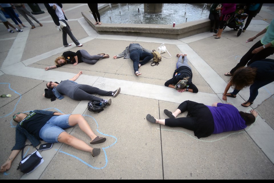 A die-in was held in St. George's Square Thursday, Aug. 31, 2017, as part of International Overdose Awareness Day. Tony Saxon/GuelphToday