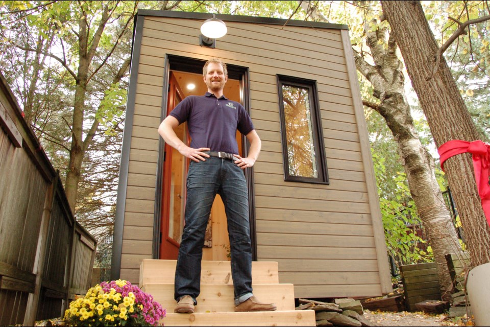 Steve Reid stands in front of his model cabin office, launched on Saturday. Richard Vivian/GuelphToday
