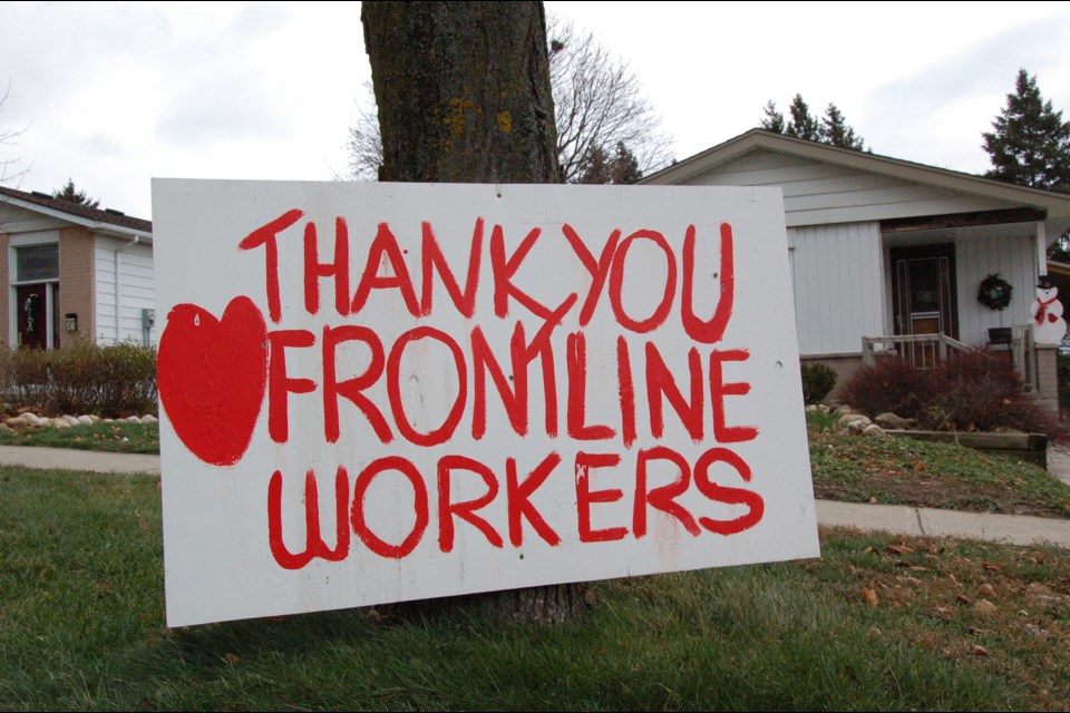 Sandy Rogers created this sign and fixed it to a tree outside his Eastview Road home. Richard Vivian/GuelphToday