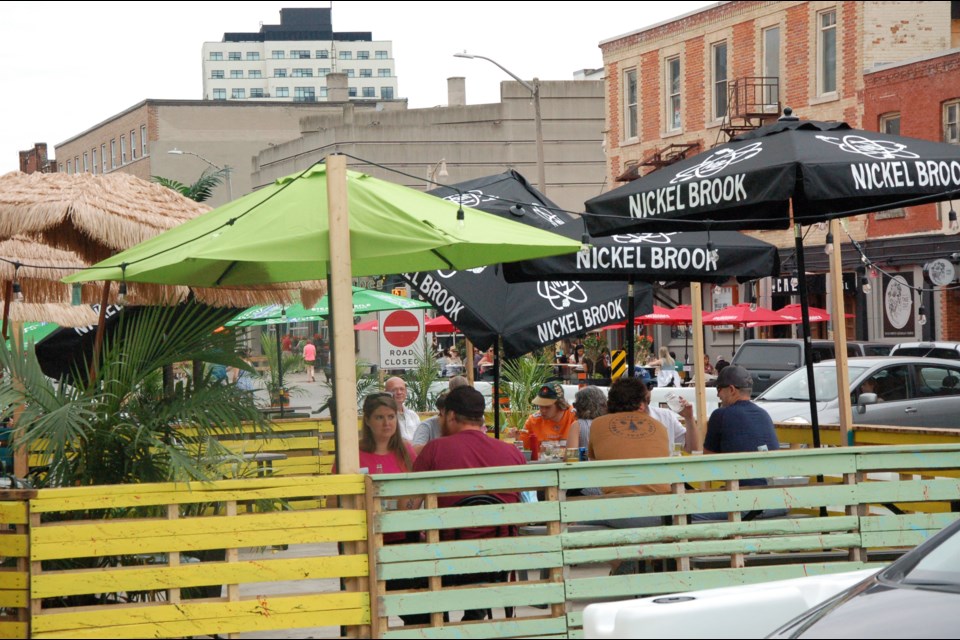 Patio dining returned, attracting people to the area around Wyndham and Macdonell streets in Downtown, where the intersection will close each weekend during the summer.