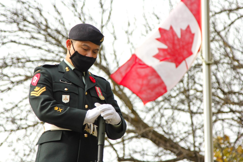 A serving member of the Canadian Forces stands by the cenotaph during a moment of silence on Remembrance Day. The Royal Canadian Legion held two ceremonies on Thursday. The first one was held at the McCrae House and the second was held at the cenotaph. 