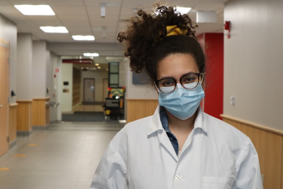 Youstina Makhlouf in her lab coat at the University of Guelph