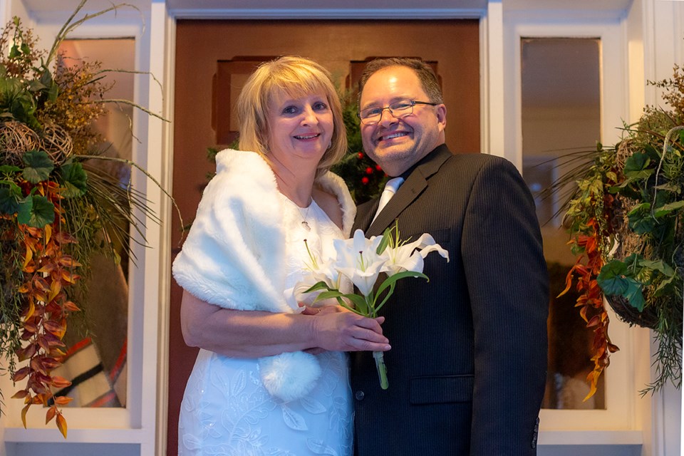 Lisa and Dave Walker smiling on their big day
