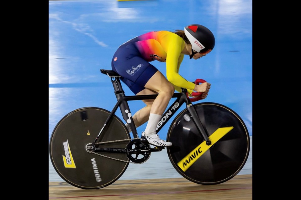 Kiara Lylyk riding track in an indoor track ring.