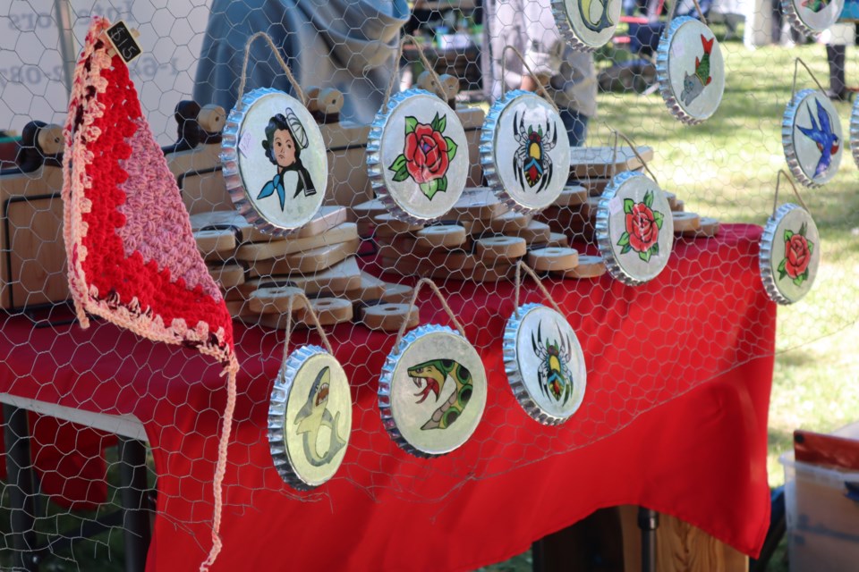On Saturday vendors set up for Handmade Market in the Park at Royal City Park to sell a variety of crafted items like jewelry, candles, and art.