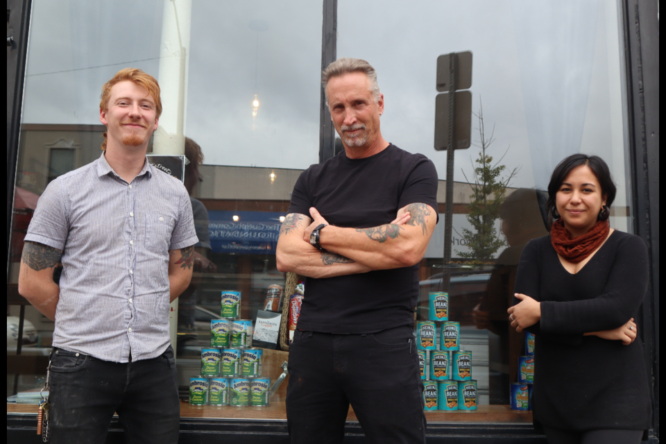 Fleetstreets owners Keaghan Nelson, Chailey Nelson and Alyssa Augas stand outside the bake shop posed like a British boy band.