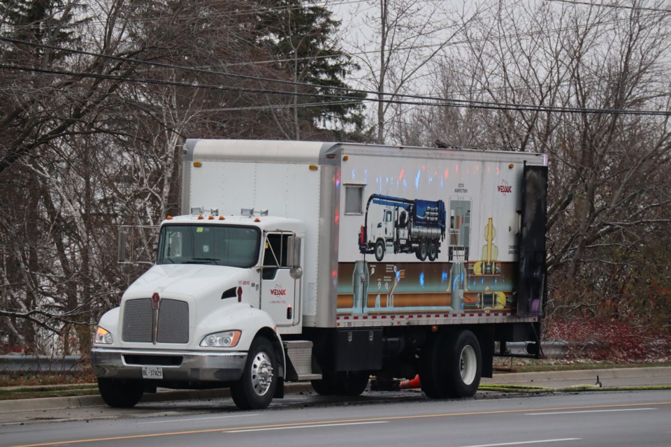 A badly damaged truck sits parked on Stone Road after it caught fire Tuesday afternoon.
