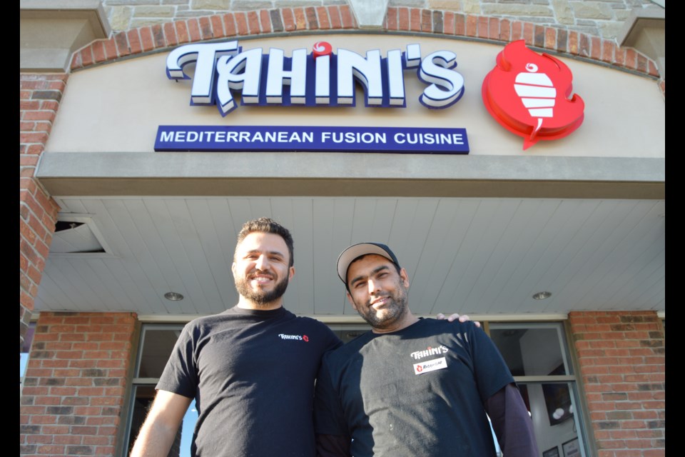 Ali Tahini and Muddussar Shah outside their restaurant in Guelph.